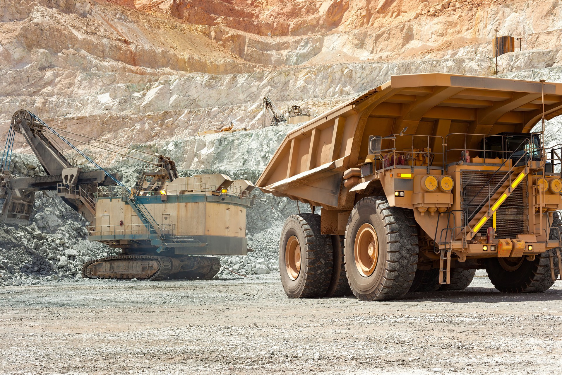 Electric rope shovel and dump truck at a copper mine in Peru